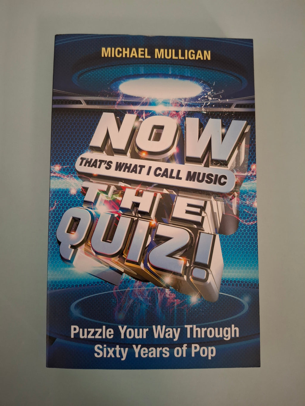 Michael Mulligan - NOW That's What I Call Music: The Quiz! - Puzzle Your Way Through Sixty Years of Pop - Paperback Pop Trivia Guide (Trapeze, 2018)